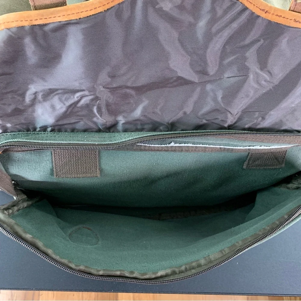 High Sierra Green canvas and Brown leather Duffel Bag.